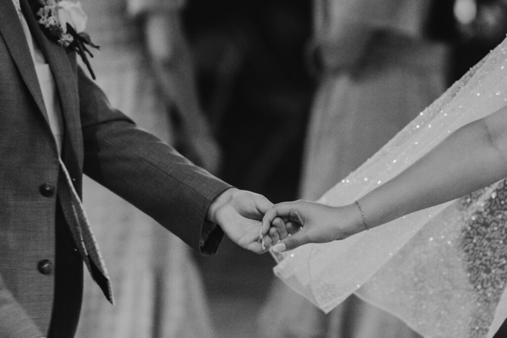 Bride and groom holding hands at a lds/mormon church wedding held in Hemet, California