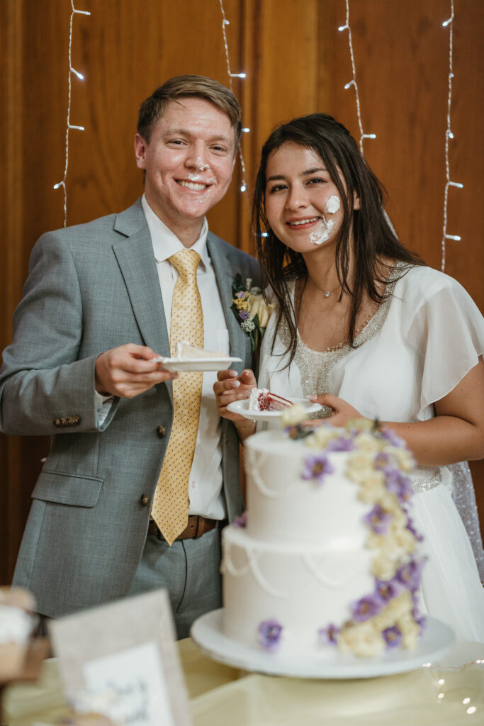 Bride and groom smiling after cutting the wedding cake at a lds/mormon church wedding held in Hemet, California