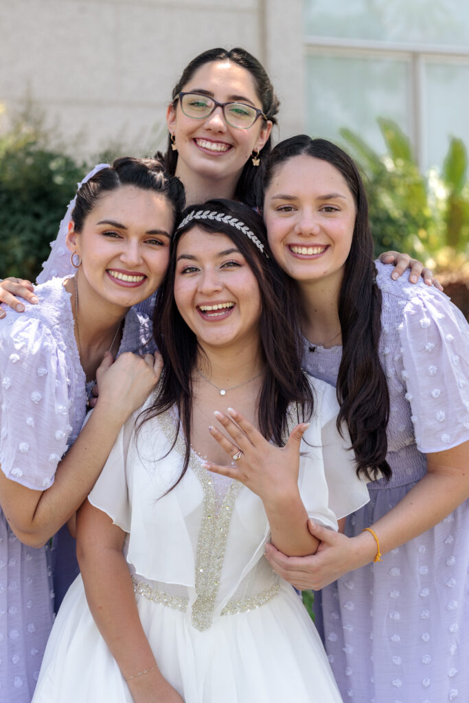 Bridesmaids pose outside the Redlands LDS temple on their wedding day.