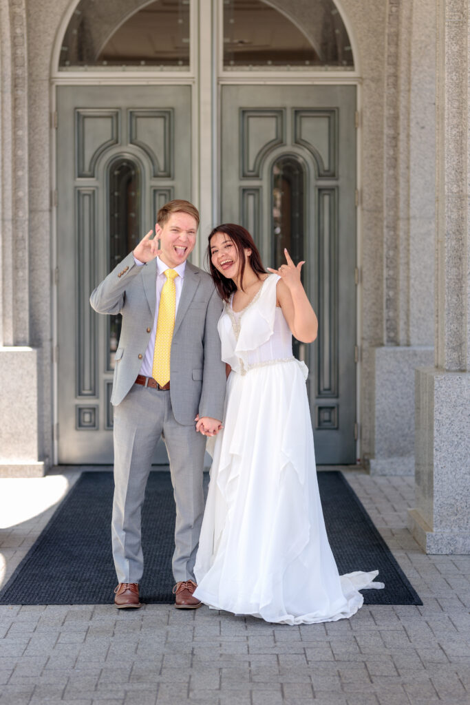 Couple stands outside the Redlands LDS temple on their wedding day.