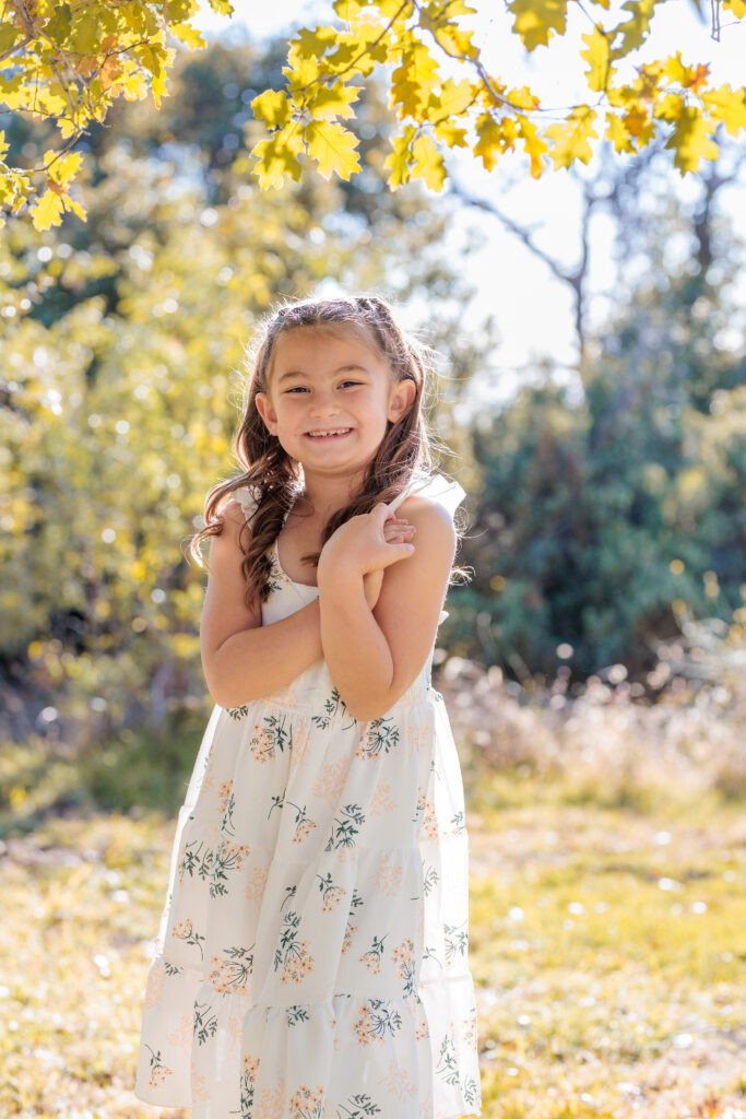 Young girl smiling in Oak Glen, CA for photoshoot. 