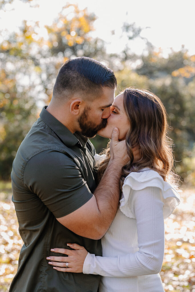 Couple kissing in Oak Glen, CA